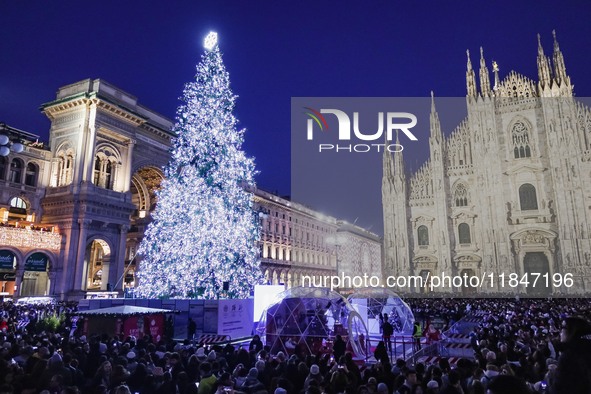 A moment of the lighting ceremony of the Christmas tree of the Olympic and Paralympic Games takes place in Piazza Duomo in Milan, Italy, on...