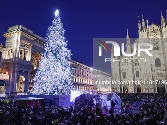 A moment of the lighting ceremony of the Christmas tree of the Olympic and Paralympic Games takes place in Piazza Duomo in Milan, Italy, on...