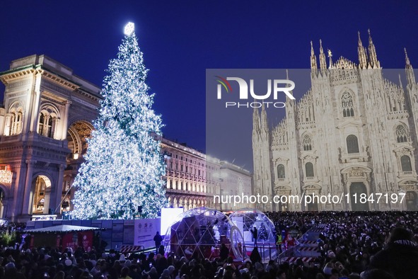 A moment of the lighting ceremony of the Christmas tree of the Olympic and Paralympic Games takes place in Piazza Duomo in Milan, Italy, on...