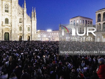 A moment of the lighting ceremony of the Christmas tree of the Olympic and Paralympic Games takes place in Piazza Duomo in Milan, Italy, on...