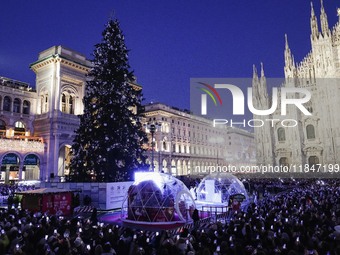 A moment of the lighting ceremony of the Christmas tree of the Olympic and Paralympic Games takes place in Piazza Duomo in Milan, Italy, on...