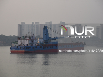 A Kolkata Port Trust ship works on the drainage system on a foggy morning amid rising air pollution levels in Kolkata, India, on December 8,...