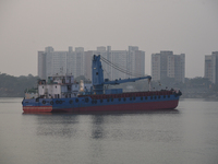 A Kolkata Port Trust ship works on the drainage system on a foggy morning amid rising air pollution levels in Kolkata, India, on December 8,...