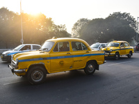 Yellow taxis move on the road in Kolkata, India, on December 8, 2024. Kolkata says goodbye to its yellow taxis. A court order removes older...