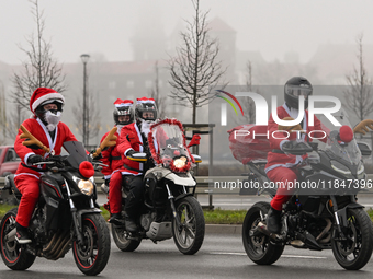 KRAKOW, POLAND - DECEMBER 08: Hundreds of motorcycle riders dressed as Santa Claus on their way to deliver Christmas gifts to young patients...