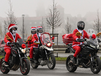 KRAKOW, POLAND - DECEMBER 08: Hundreds of motorcycle riders dressed as Santa Claus on their way to deliver Christmas gifts to young patients...