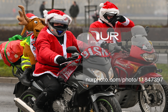 KRAKOW, POLAND - DECEMBER 08: Hundreds of motorcycle riders dressed as Santa Claus on their way to deliver Christmas gifts to young patients...