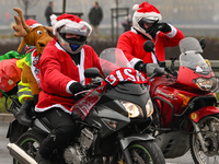 KRAKOW, POLAND - DECEMBER 08: Hundreds of motorcycle riders dressed as Santa Claus on their way to deliver Christmas gifts to young patients...