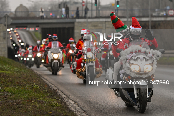 KRAKOW, POLAND - DECEMBER 08: Hundreds of motorcycle riders dressed as Santa Claus on their way to deliver Christmas gifts to young patients...