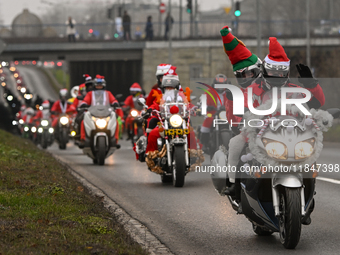 KRAKOW, POLAND - DECEMBER 08: Hundreds of motorcycle riders dressed as Santa Claus on their way to deliver Christmas gifts to young patients...