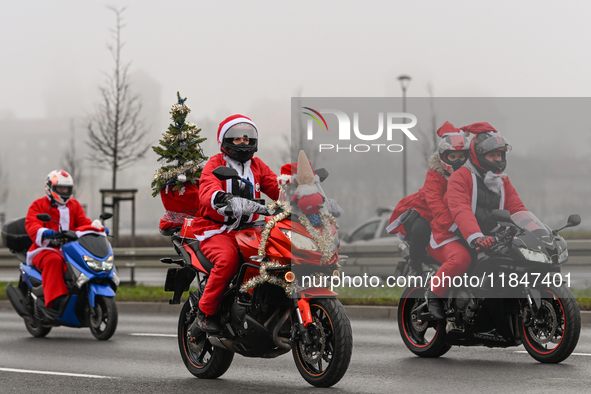 KRAKOW, POLAND - DECEMBER 08: Hundreds of motorcycle riders dressed as Santa Claus on their way to deliver Christmas gifts to young patients...