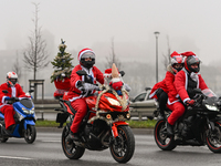 KRAKOW, POLAND - DECEMBER 08: Hundreds of motorcycle riders dressed as Santa Claus on their way to deliver Christmas gifts to young patients...