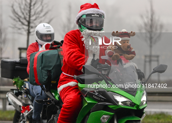 KRAKOW, POLAND - DECEMBER 08: Hundreds of motorcycle riders dressed as Santa Claus on their way to deliver Christmas gifts to young patients...