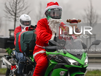 KRAKOW, POLAND - DECEMBER 08: Hundreds of motorcycle riders dressed as Santa Claus on their way to deliver Christmas gifts to young patients...