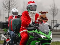 KRAKOW, POLAND - DECEMBER 08: Hundreds of motorcycle riders dressed as Santa Claus on their way to deliver Christmas gifts to young patients...