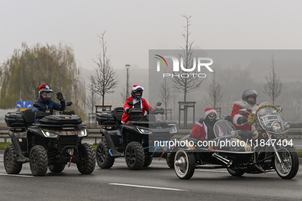 KRAKOW, POLAND - DECEMBER 08: Hundreds of motorcycle riders dressed as Santa Claus on their way to deliver Christmas gifts to young patients...