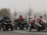 KRAKOW, POLAND - DECEMBER 08: Hundreds of motorcycle riders dressed as Santa Claus on their way to deliver Christmas gifts to young patients...