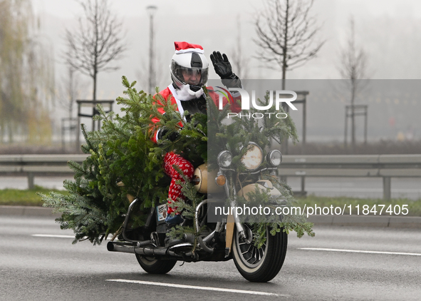 KRAKOW, POLAND - DECEMBER 08: Hundreds of motorcycle riders dressed as Santa Claus on their way to deliver Christmas gifts to young patients...