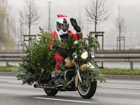 KRAKOW, POLAND - DECEMBER 08: Hundreds of motorcycle riders dressed as Santa Claus on their way to deliver Christmas gifts to young patients...