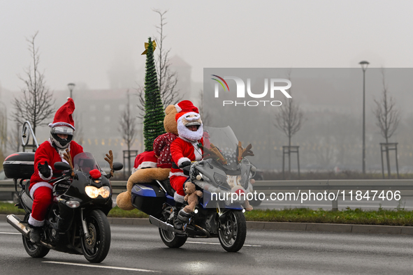 KRAKOW, POLAND - DECEMBER 08: Hundreds of motorcycle riders dressed as Santa Claus on their way to deliver Christmas gifts to young patients...