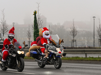 KRAKOW, POLAND - DECEMBER 08: Hundreds of motorcycle riders dressed as Santa Claus on their way to deliver Christmas gifts to young patients...