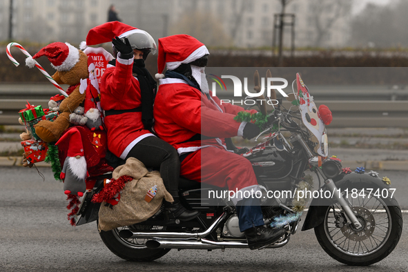 KRAKOW, POLAND - DECEMBER 08: Hundreds of motorcycle riders dressed as Santa Claus on their way to deliver Christmas gifts to young patients...