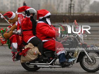 KRAKOW, POLAND - DECEMBER 08: Hundreds of motorcycle riders dressed as Santa Claus on their way to deliver Christmas gifts to young patients...