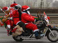 KRAKOW, POLAND - DECEMBER 08: Hundreds of motorcycle riders dressed as Santa Claus on their way to deliver Christmas gifts to young patients...