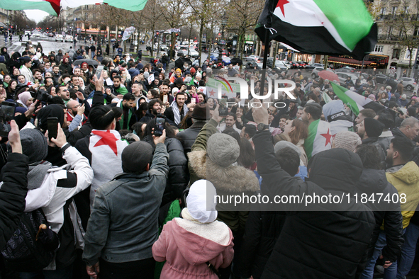 A demonstration by the Syrian community takes place at Place de la Republique in Paris, France, on December 8, 2024, to celebrate Syria's fr...