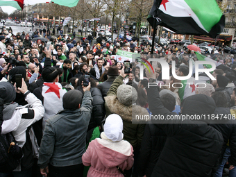 A demonstration by the Syrian community takes place at Place de la Republique in Paris, France, on December 8, 2024, to celebrate Syria's fr...