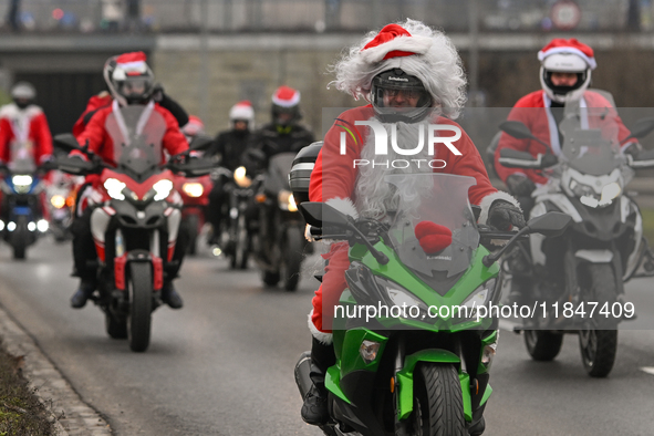 KRAKOW, POLAND - DECEMBER 08: Hundreds of motorcycle riders dressed as Santa Claus on their way to deliver Christmas gifts to young patients...