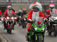 KRAKOW, POLAND - DECEMBER 08: Hundreds of motorcycle riders dressed as Santa Claus on their way to deliver Christmas gifts to young patients...