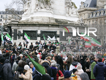 A demonstration by the Syrian community takes place at Place de la Republique in Paris, France, on December 8, 2024, to celebrate Syria's fr...