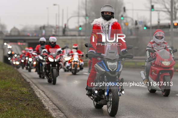 KRAKOW, POLAND - DECEMBER 08: Hundreds of motorcycle riders dressed as Santa Claus on their way to deliver Christmas gifts to young patients...