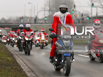 KRAKOW, POLAND - DECEMBER 08: Hundreds of motorcycle riders dressed as Santa Claus on their way to deliver Christmas gifts to young patients...