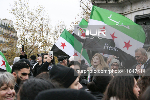 A demonstration by the Syrian community takes place at Place de la Republique in Paris, France, on December 8, 2024, to celebrate Syria's fr...