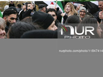 A demonstration by the Syrian community takes place at Place de la Republique in Paris, France, on December 8, 2024, to celebrate Syria's fr...