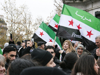 A demonstration by the Syrian community takes place at Place de la Republique in Paris, France, on December 8, 2024, to celebrate Syria's fr...