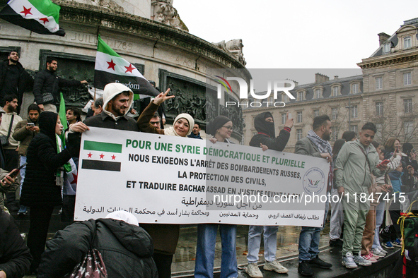 A demonstration by the Syrian community takes place at Place de la Republique in Paris, France, on December 8, 2024, to celebrate Syria's fr...