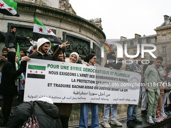 A demonstration by the Syrian community takes place at Place de la Republique in Paris, France, on December 8, 2024, to celebrate Syria's fr...