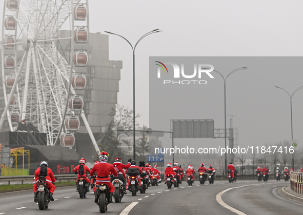 KRAKOW, POLAND - DECEMBER 08: Hundreds of motorcycle riders dressed as Santa Claus on their way to deliver Christmas gifts to young patients...