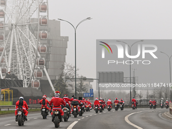 KRAKOW, POLAND - DECEMBER 08: Hundreds of motorcycle riders dressed as Santa Claus on their way to deliver Christmas gifts to young patients...