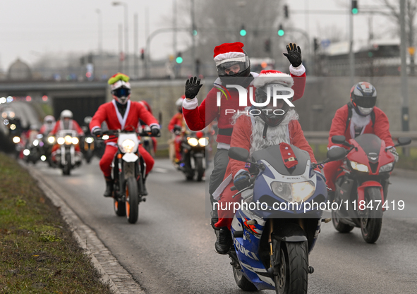 KRAKOW, POLAND - DECEMBER 08: Hundreds of motorcycle riders dressed as Santa Claus on their way to deliver Christmas gifts to young patients...