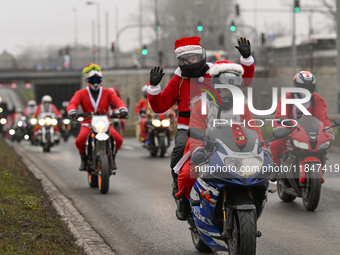 KRAKOW, POLAND - DECEMBER 08: Hundreds of motorcycle riders dressed as Santa Claus on their way to deliver Christmas gifts to young patients...