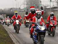 KRAKOW, POLAND - DECEMBER 08: Hundreds of motorcycle riders dressed as Santa Claus on their way to deliver Christmas gifts to young patients...