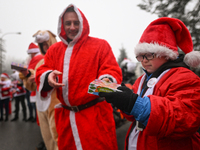 KRAKOW, POLAND - DECEMBER 08: Hundreds of motorcycle riders dressed as Santa Claus form a human chain to deliver Christmas gifts to young pa...