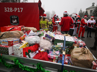 KRAKOW, POLAND - DECEMBER 08: Hundreds of motorcycle riders dressed as Santa Claus form a human chain to deliver Christmas gifts to young pa...