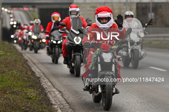 KRAKOW, POLAND - DECEMBER 08: Hundreds of motorcycle riders dressed as Santa Claus on their way to deliver Christmas gifts to young patients...