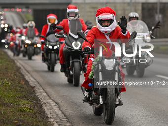 KRAKOW, POLAND - DECEMBER 08: Hundreds of motorcycle riders dressed as Santa Claus on their way to deliver Christmas gifts to young patients...