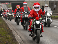 KRAKOW, POLAND - DECEMBER 08: Hundreds of motorcycle riders dressed as Santa Claus on their way to deliver Christmas gifts to young patients...